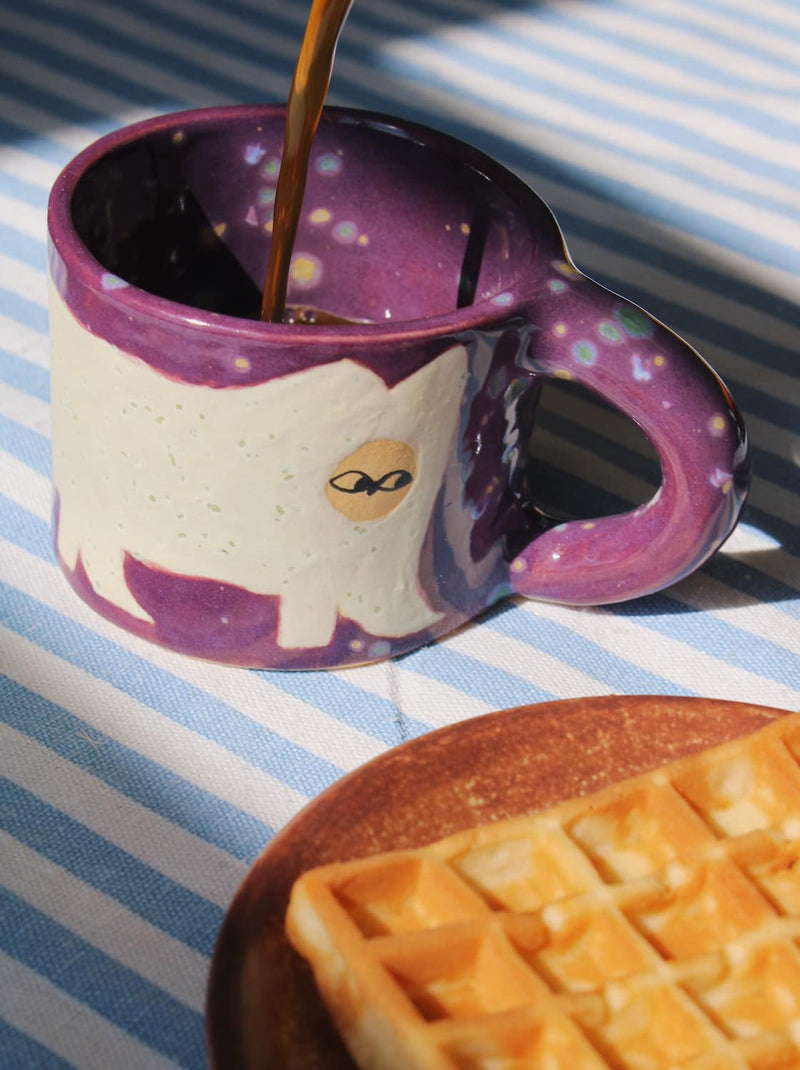 Mulberry ceramic cat mug with hand-painted purple glaze and playful handle detail