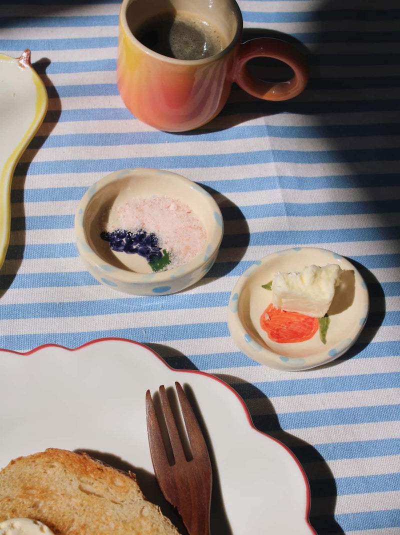 Handmade Pomina trinket dish and Vinea trinket dish with colorful fruit motif styled with breakfast setting