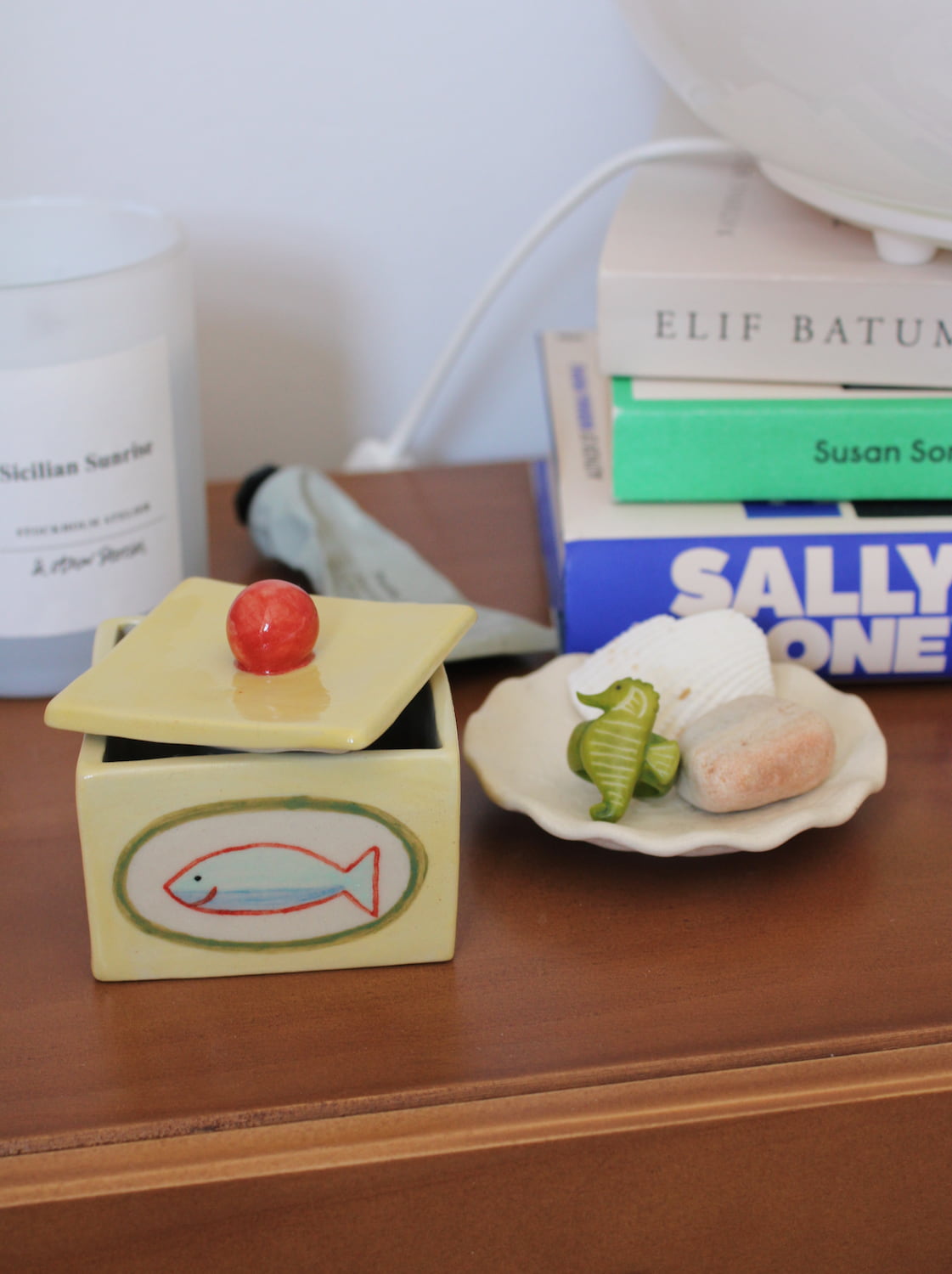 Ceramic Sardina storage box with playful fish design and sculptural red lid detail