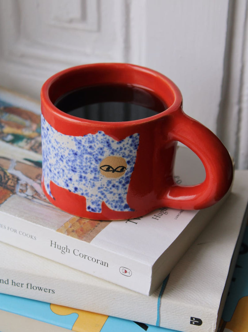 Scarlet ceramic cat mug with hand-painted blue cat illustration and red handle