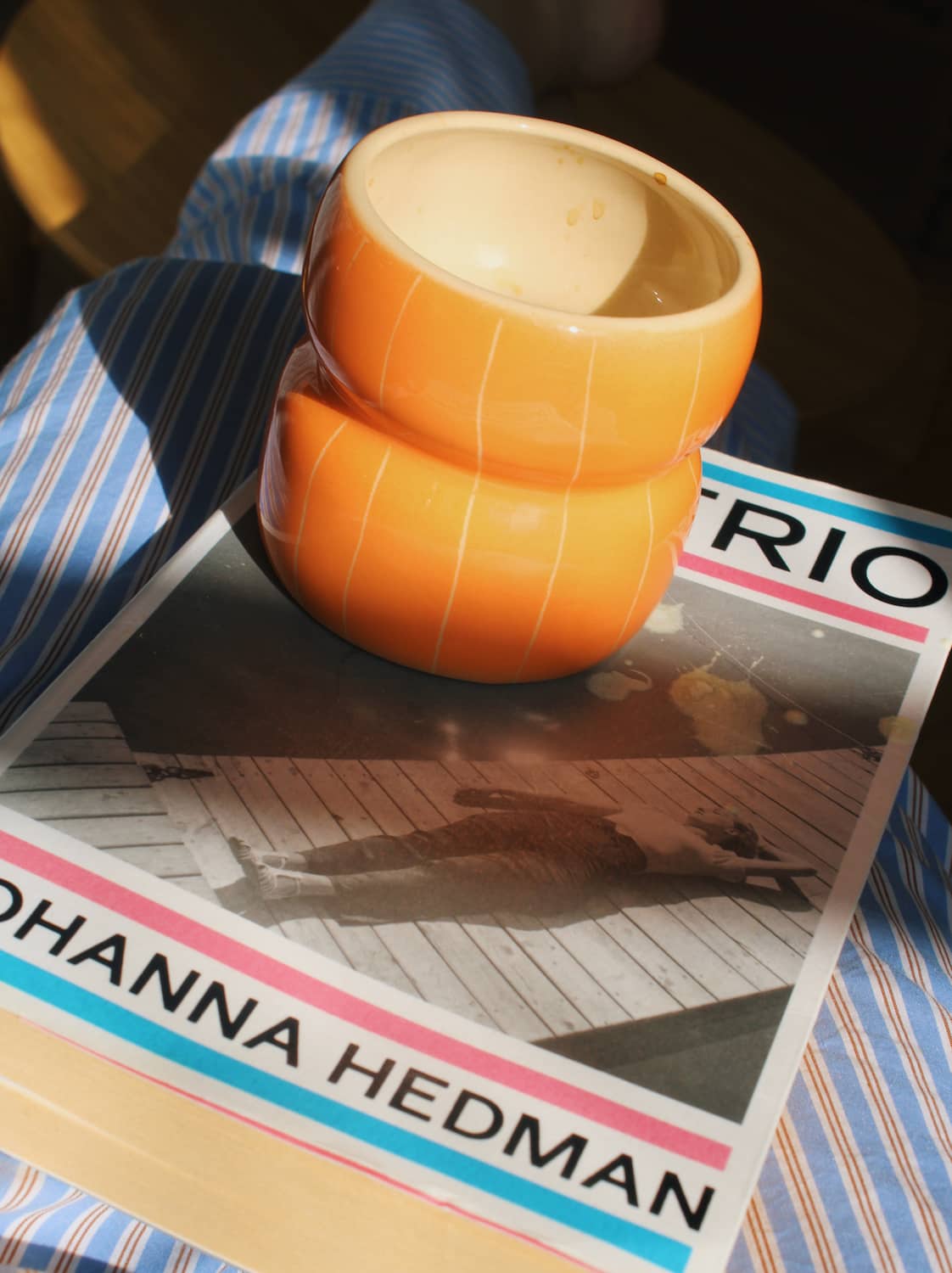 Tangerine ceramic cup in warm orange glaze, handmade coffee mug for cozy morning table